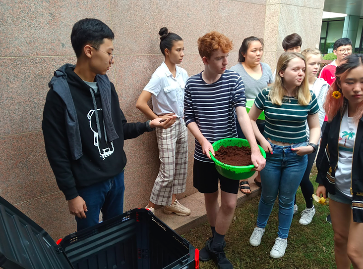 Students at SAS Puxi Campus setting up a compost bin as part of a science class Students at SAS Puxi Campus setting up a compost bin as part of a science class